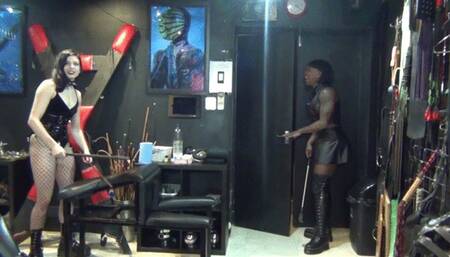 Slave gets a good caning from his dominant mistresses