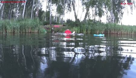 Alla swims in the lake and wears a red inflatable vest!!!