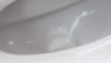Shooting sperm in the toilet