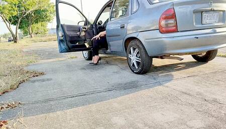 Diana Senior Cold Starting the Chevy Corsa on Black Classic Pumps