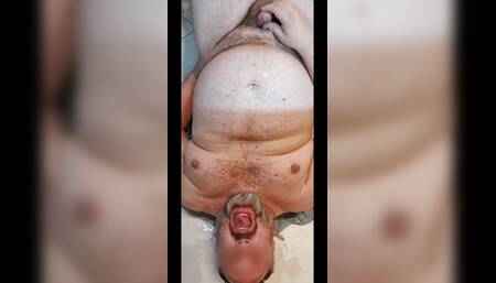 Fat bear swallows his pee