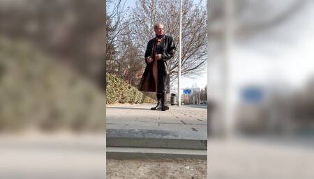 Exhibi naked under coat in the street