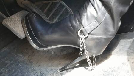 Tall hottie in Gianmarco Lorenzi high heels boots driving and pedal pumping