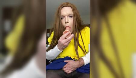 Practicing sucking on a dildo