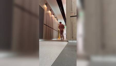 Naked dog in gym locker