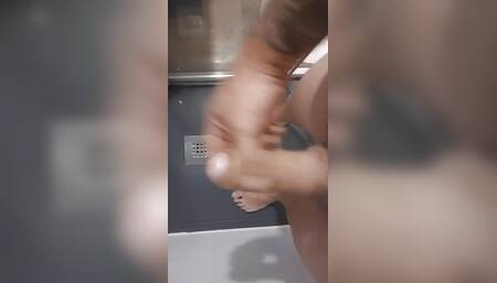 I masturbate in the shower while I feel the hot pee pissing my feet