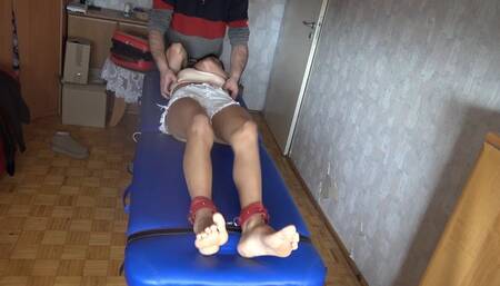 Tickling Simona Shy body on the table