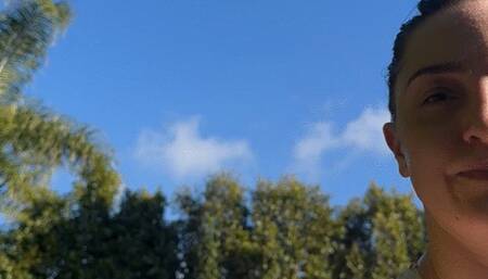 Jane is hot is a wet swim suit jumping on a huge inflatable