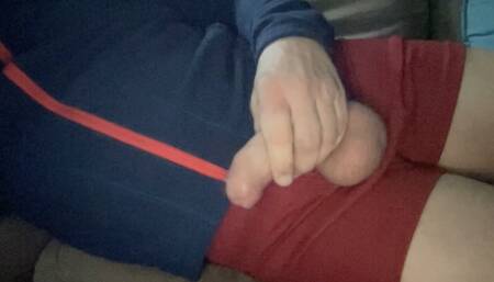 Stroking wearing gym teacher shorts, online video chatting with another coach.