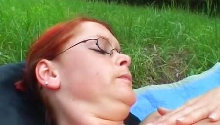 Redhead slut from Germany gets her pussy dildoed outdoors