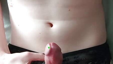 Crossdressing Twink masturbates and cums on his belly