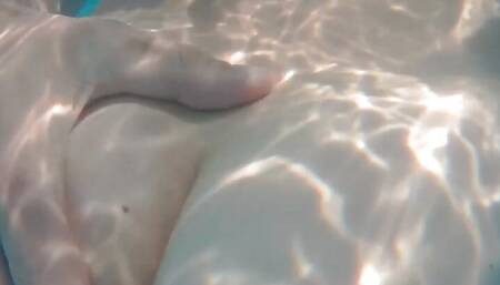 Swimming around naked in a garden pool with teasing