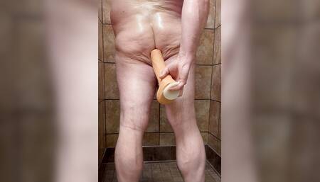 Bear chub takes on John Holmes dildo in locker room shower