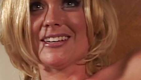 A Blonde with Fake Tits Stripteases and Then Gets Humped and Cum on Her Face