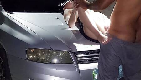 couple in the backyard while strangers passing by on the street watched