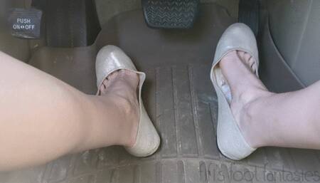 Fifi pumping the pedals of the SUV in a public parking lot wearing sparkly nude ballet flats