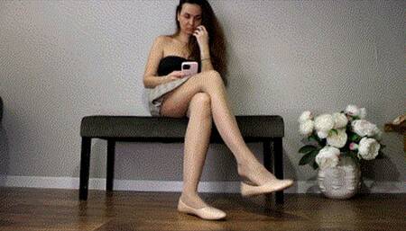 Crossed legs, dangling ballet flats AVI