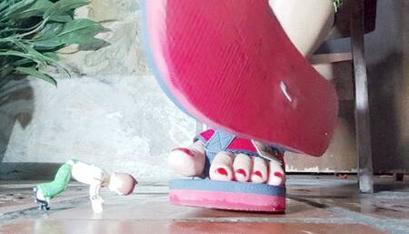 Diana Senior crushing the munequito under her sexy flip flops