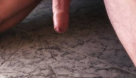 Slim guy is wanking his bushy dick and cuming