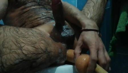 Shoving dildo up the ass