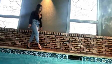 Reyna jumps in the Pool in Skinny Jeans and a Shiny Black Top