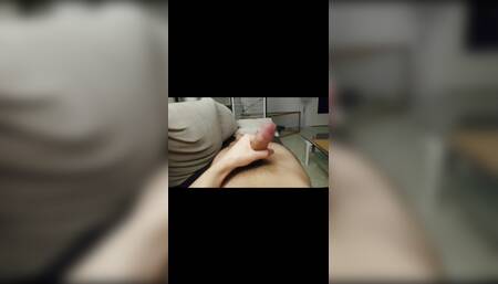 Young gay man jerks off his circumcised cock until he cums on his hot body