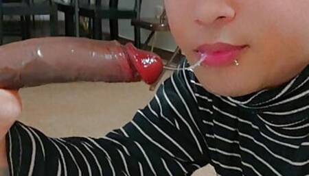 Femboi sucking big black dildo