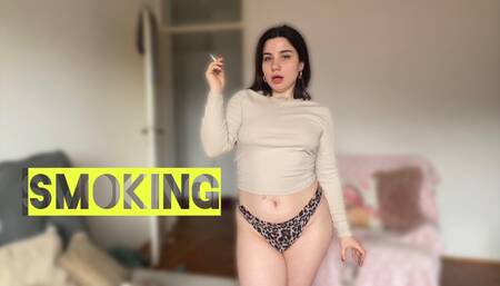 Sexy tattooed model smokes Marlboro red