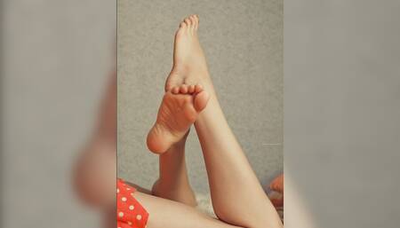 she's wearing socks and using cream for her feets