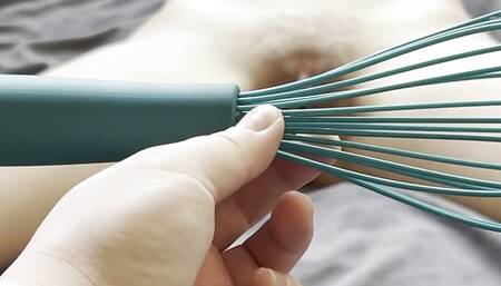 Brunette in bondage fucked by a kitchen whisk