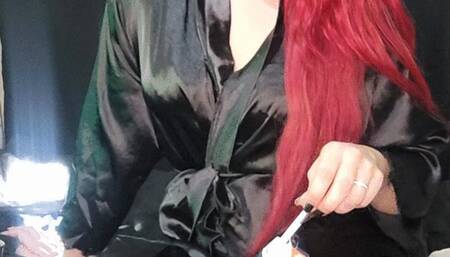 Smoking 100s in a satin robe on the bed