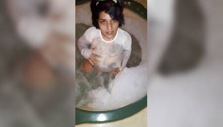 Your busty friend masturbates in the whirlpool