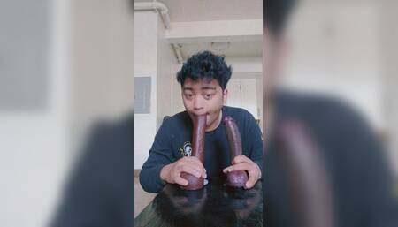 Latino Femboy sucks 2 big black dildos