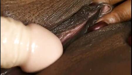 Group of black lesbians having sex with strap-on