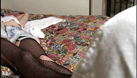 Guy is eating out the teenage pussy while she wears fishnets