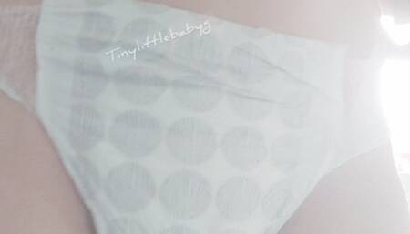 Very worn white pull up pissing