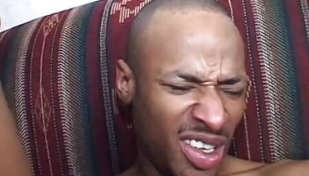 Black hunk slurps ebony babe's coochie before drilling her on the sofa