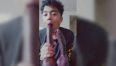 Latino bottom sucks 2 big black dildos