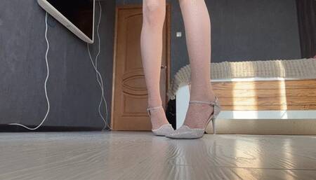 girl in nylon stockings plays with shoes and condensed milk, pours it on her shoes and licks it off