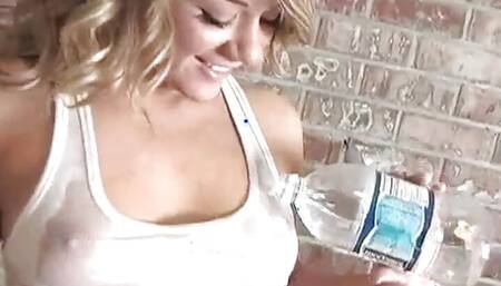 Sexy blonde dripping wet as she soaks her shirt
