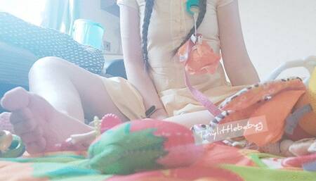 Naughty baby playtime on playmat