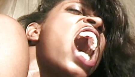 Busty black slut fucks her girlfriend's ass with a strap on