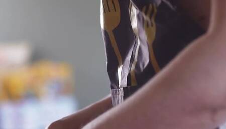 Cinematic film in which the husband films his wife undressed in the kitchen, behind the scenes