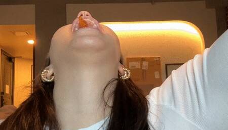 Sammie gags and swallows a gummy on a string