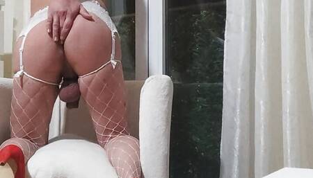 In lingerie at the window