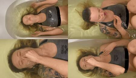 Anastasia holds her breath in the bathtub for the first time