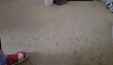 Vacuuming the floor in leggings, Birkenstock, socks