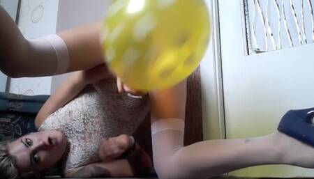girl in doggy blow to pop yellow ballon in heels
