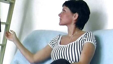 A short haired lady from Germany riding a rolling pin