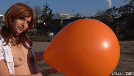 Titi blowing giant orange balloon outdoors (FULLHD quality)